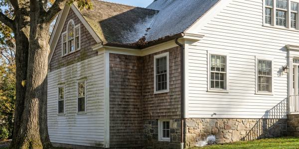 Connecticut home exterior showing uneven paint aging, shaded siding exposure and weathered cedar shingles